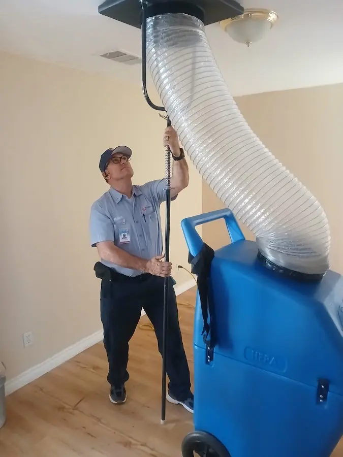 Furnace Tune-Up technician using HEPA equipment in Mount Laurel